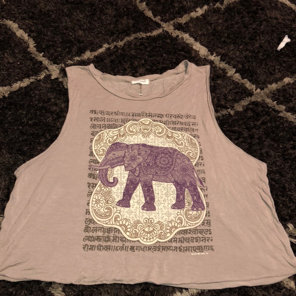 A tan brown, elephant print t-shirt